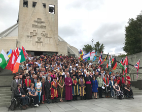 group of people outside cathedral